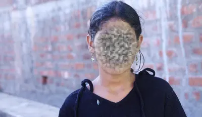 A little girl posing for a camera